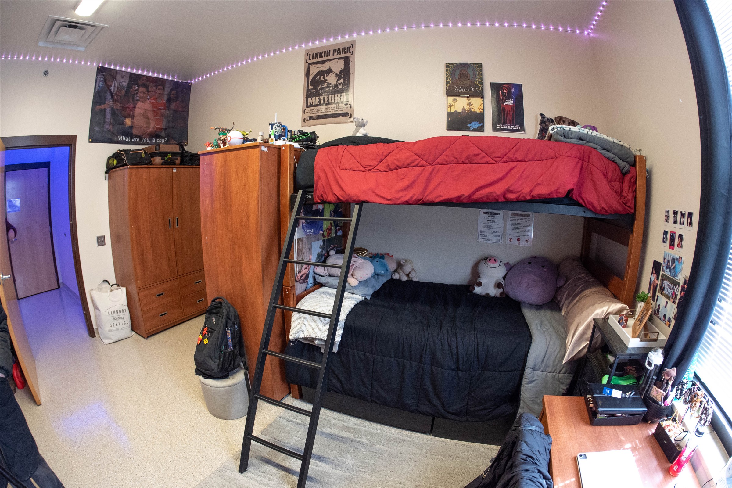 Interior of dorm room with beds with ladders